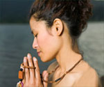 woman meditating with prayer beads