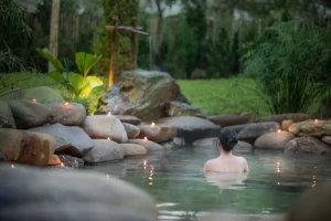 Woman using hot spring at Alba Wellness Valley - Ambika Ayurveda Panchakarma retreat 2022